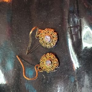 Little earrings with the rhinestone in the middle